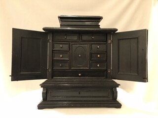  Small blackened wood cabinet with two doors